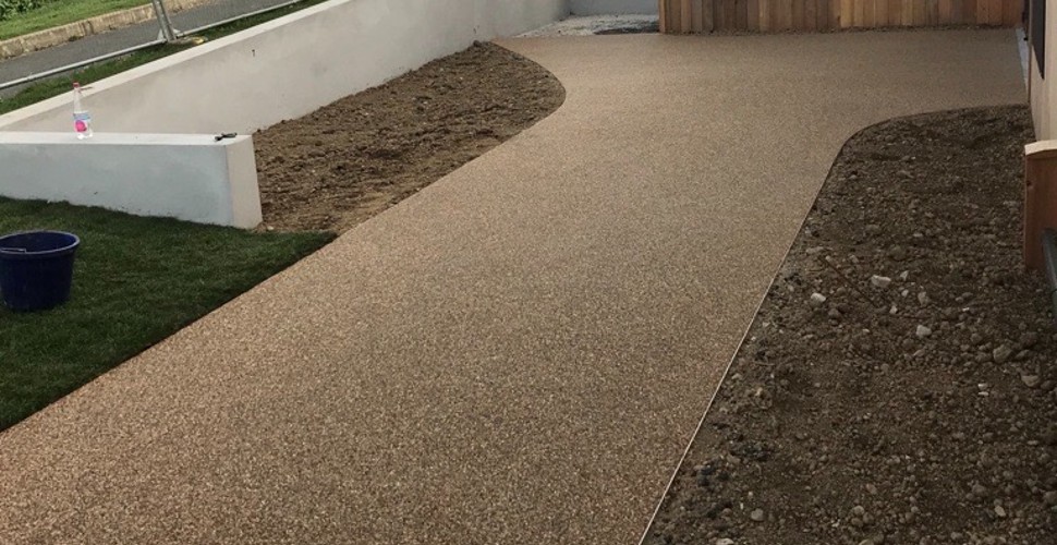 Showing the use of Recycle Base, a ground reinforcement system made utilising stone and low-grade plastic, on a driveway